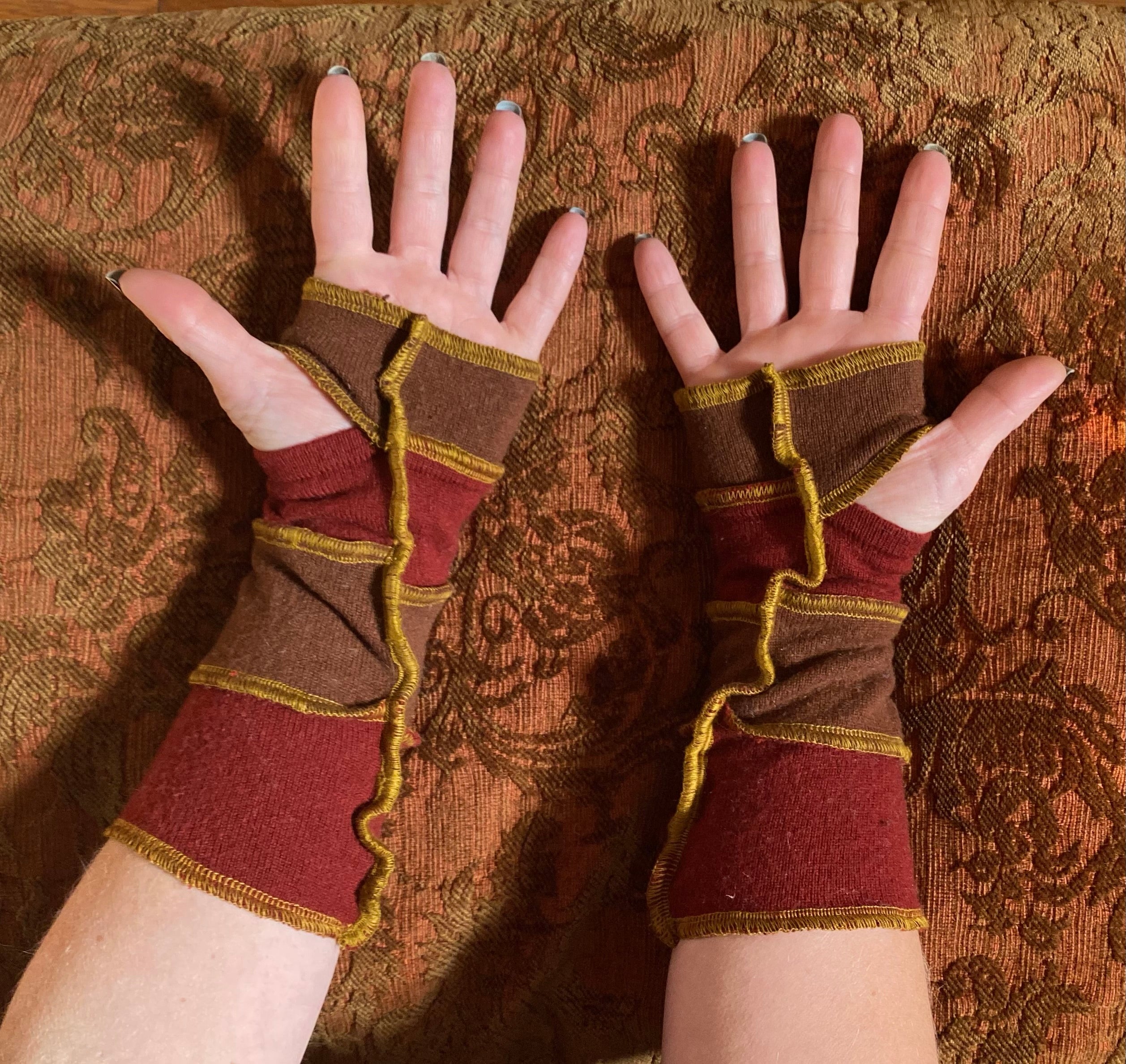 Earthy brown and rich reddish cashmere armwarmers with gold thread accents