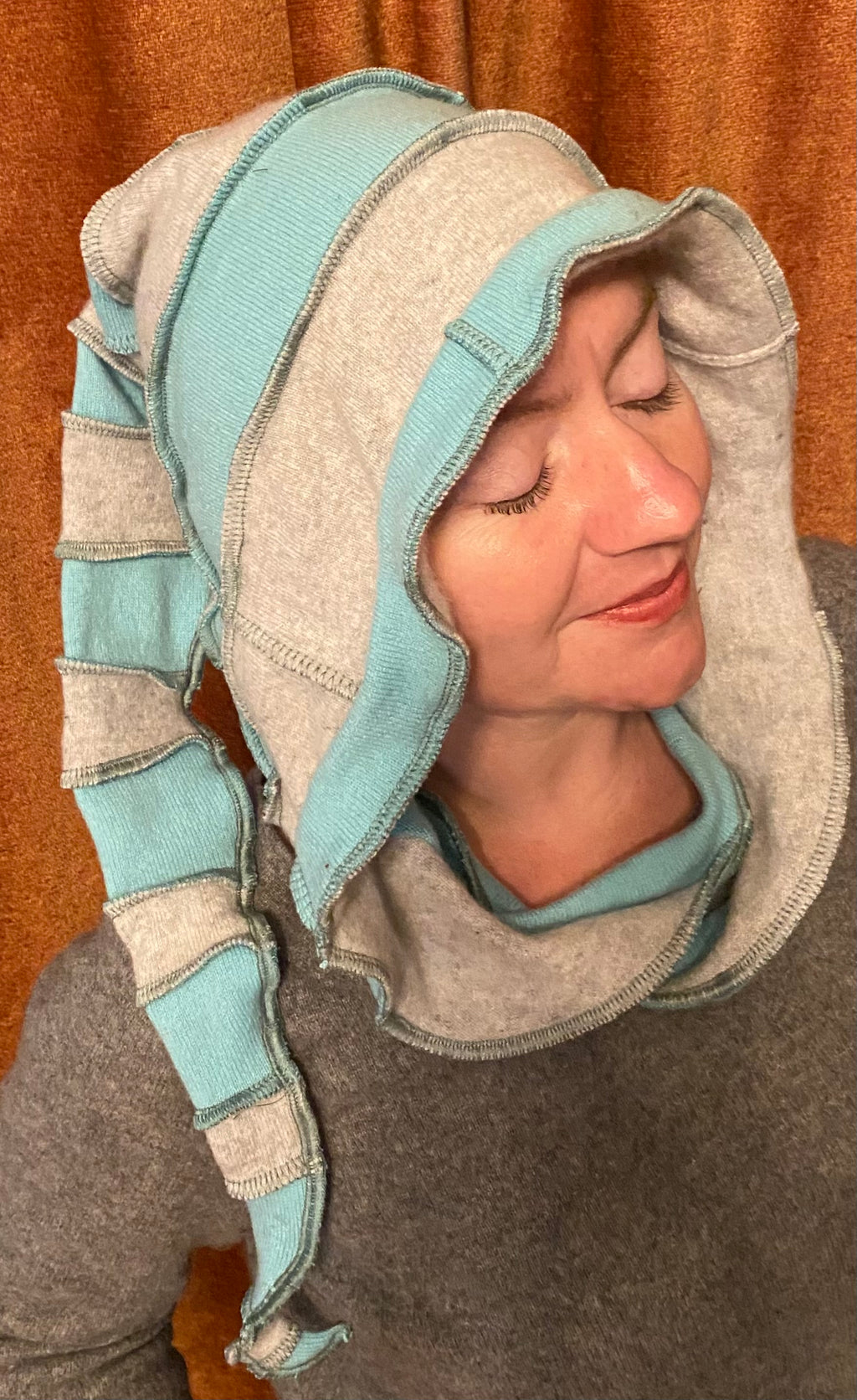 Light blue and grey cashmere hood with seafoam green thread accents